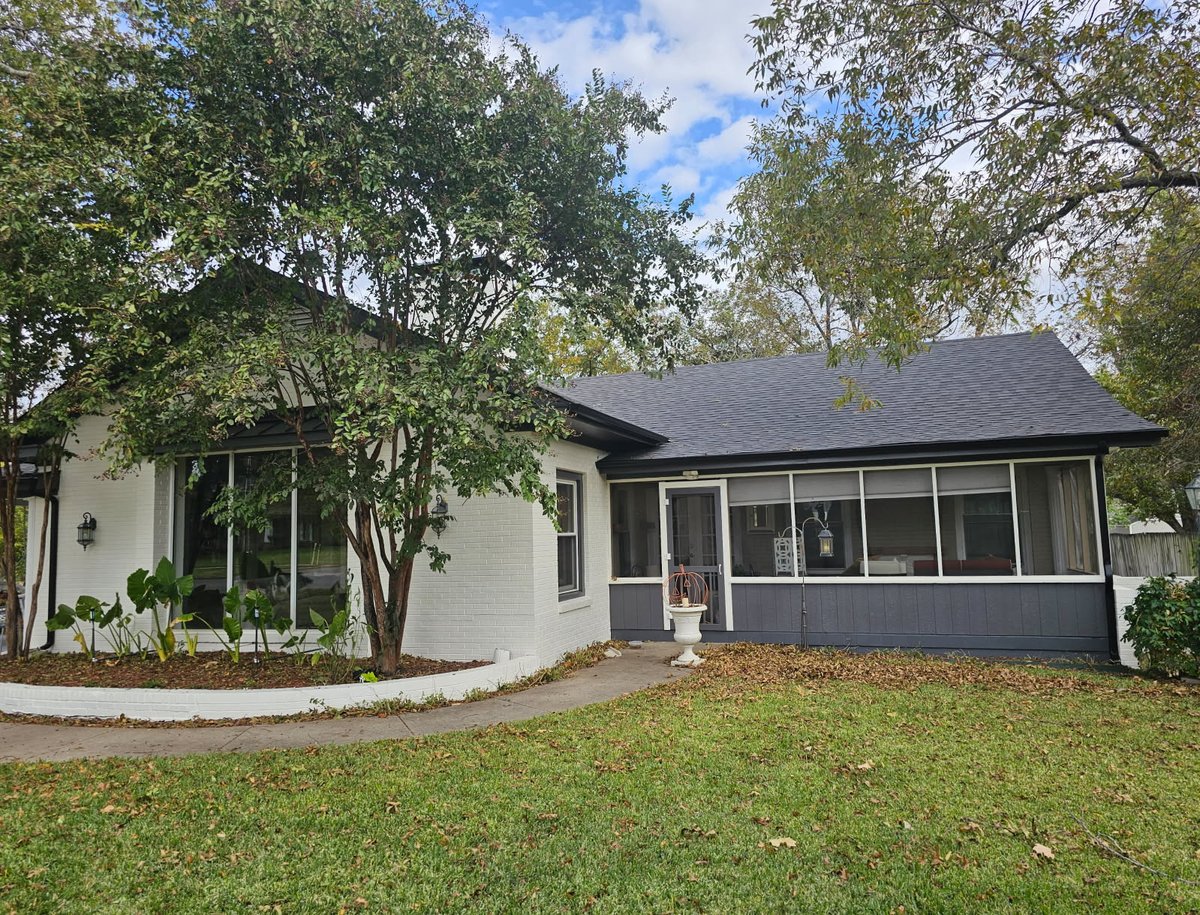 White stucco home with new roof in Johnson County, TX